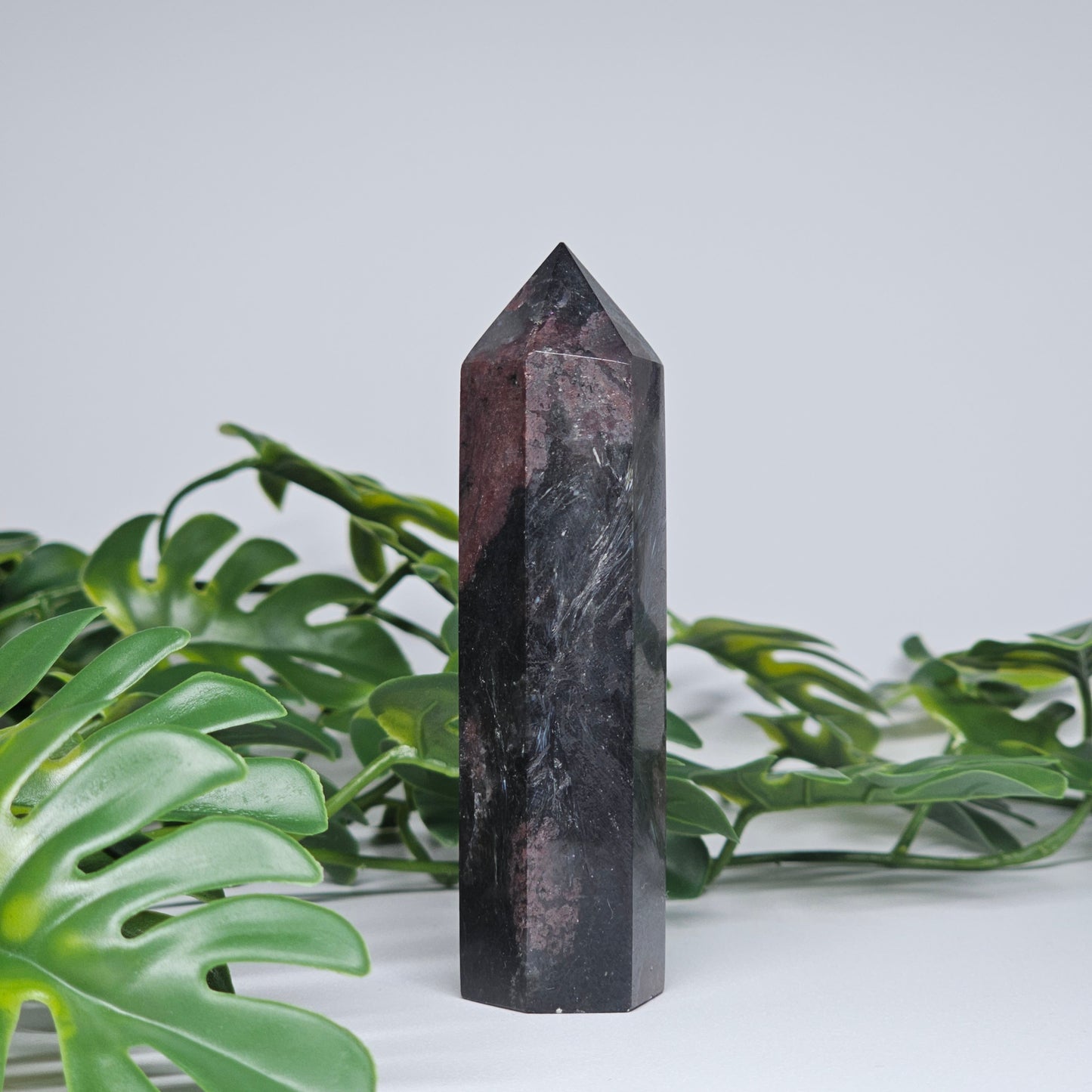 Grounding crystal tower for protection and strength displayed as home decor piece