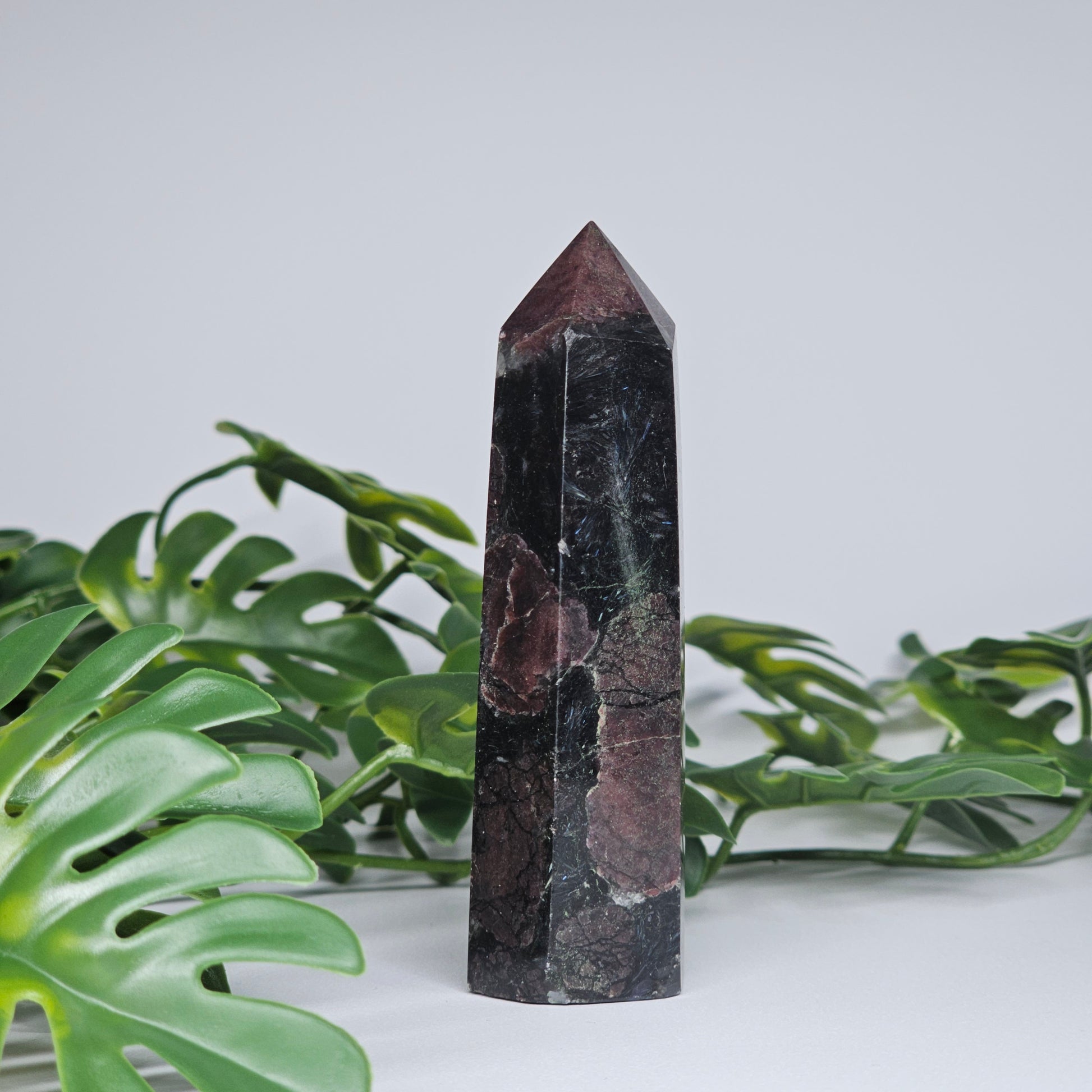 Grounding crystal tower for protection and strength displayed as home decor piece