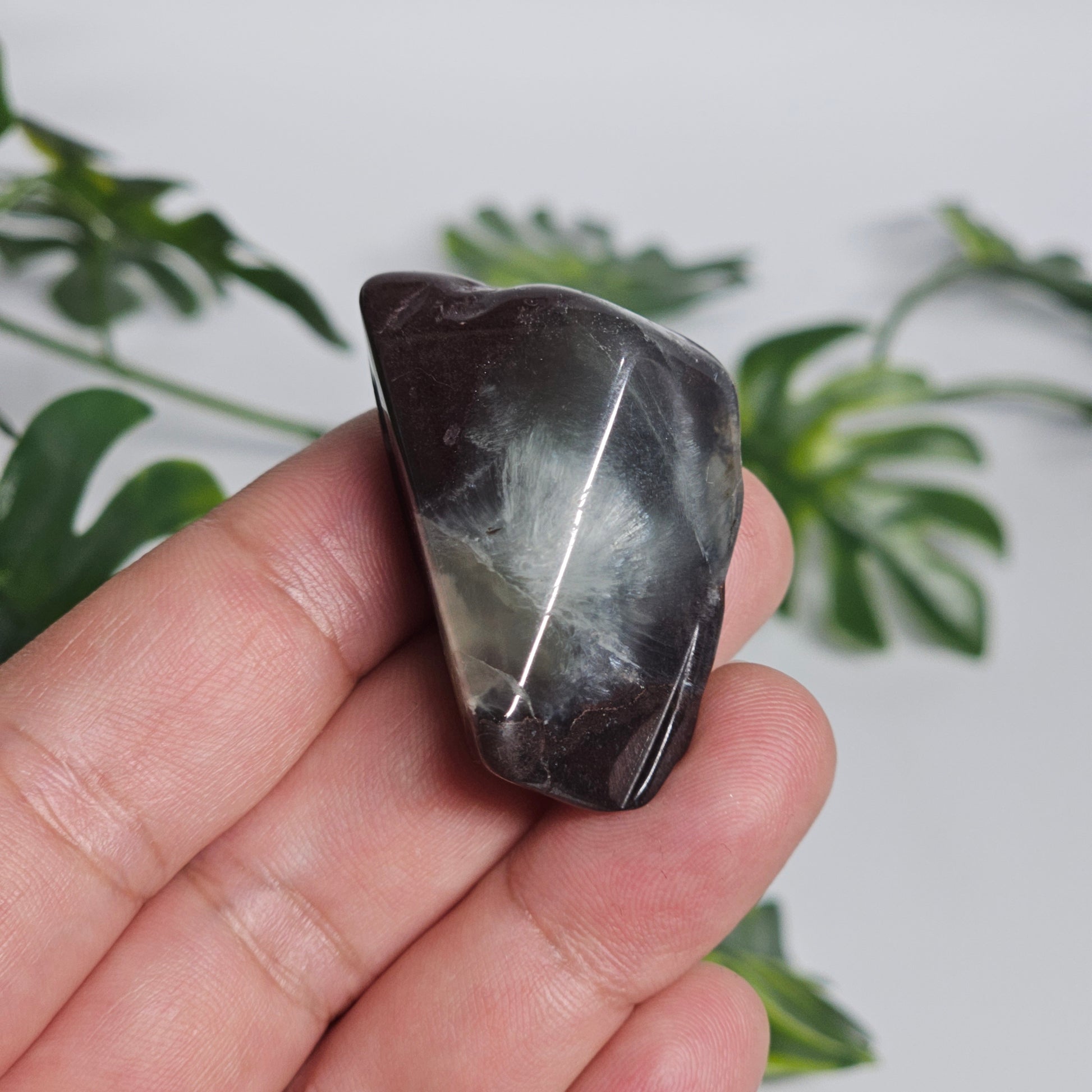 Polished Prehnite slab featuring soft green colouring, natural inclusions, and a smooth finish. Beautiful crystal display piece available in Australia.