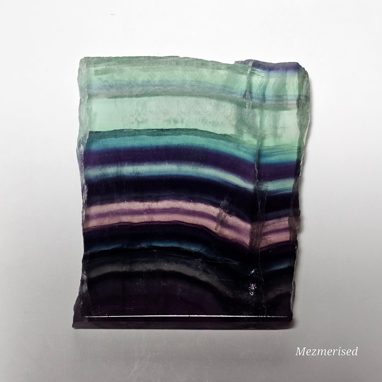 Small Fluorite slab piece laid flat showing natural pattern.