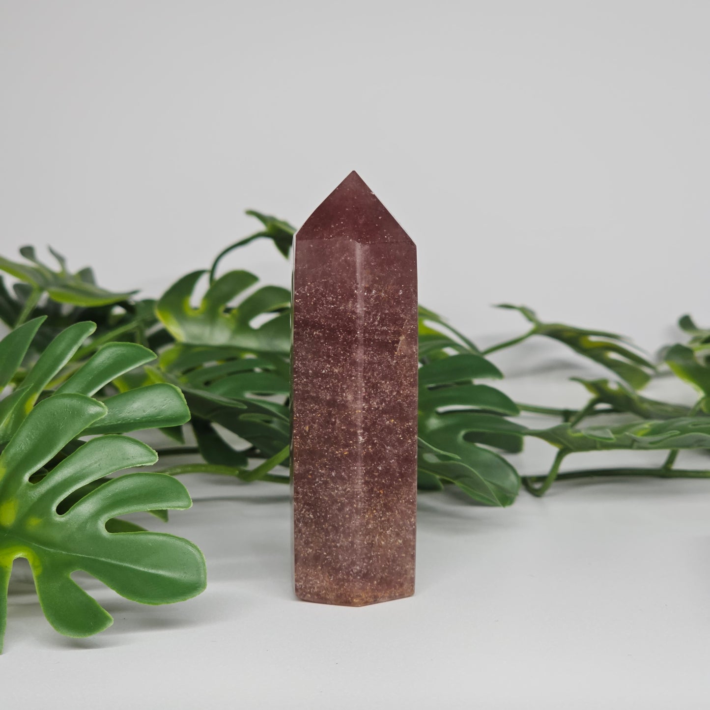 Red Aventurine crystal tower for love and positivity displayed as home decor
