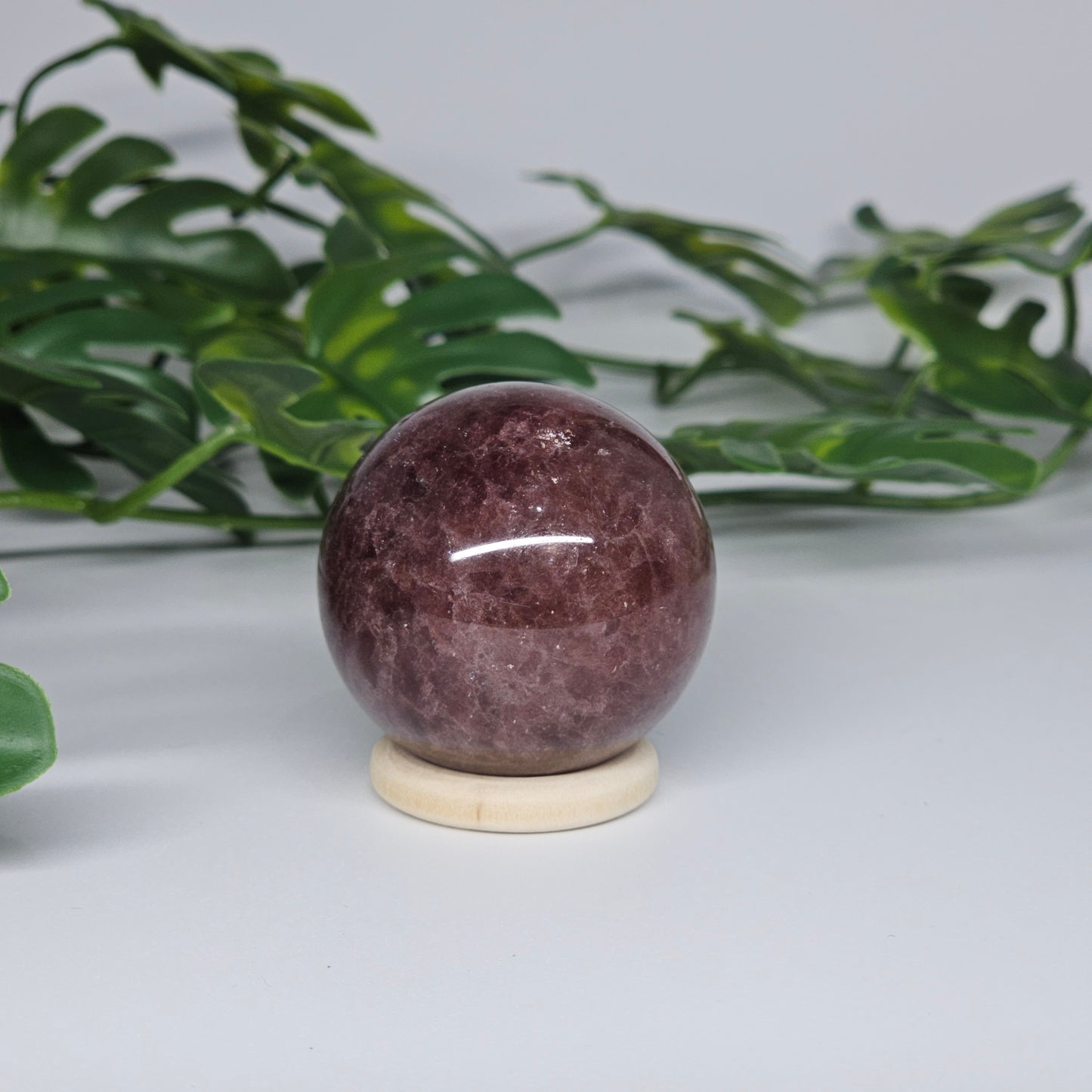 Red Aventurine crystal sphere showing full round shape with natural inclusions and reflective sparkle