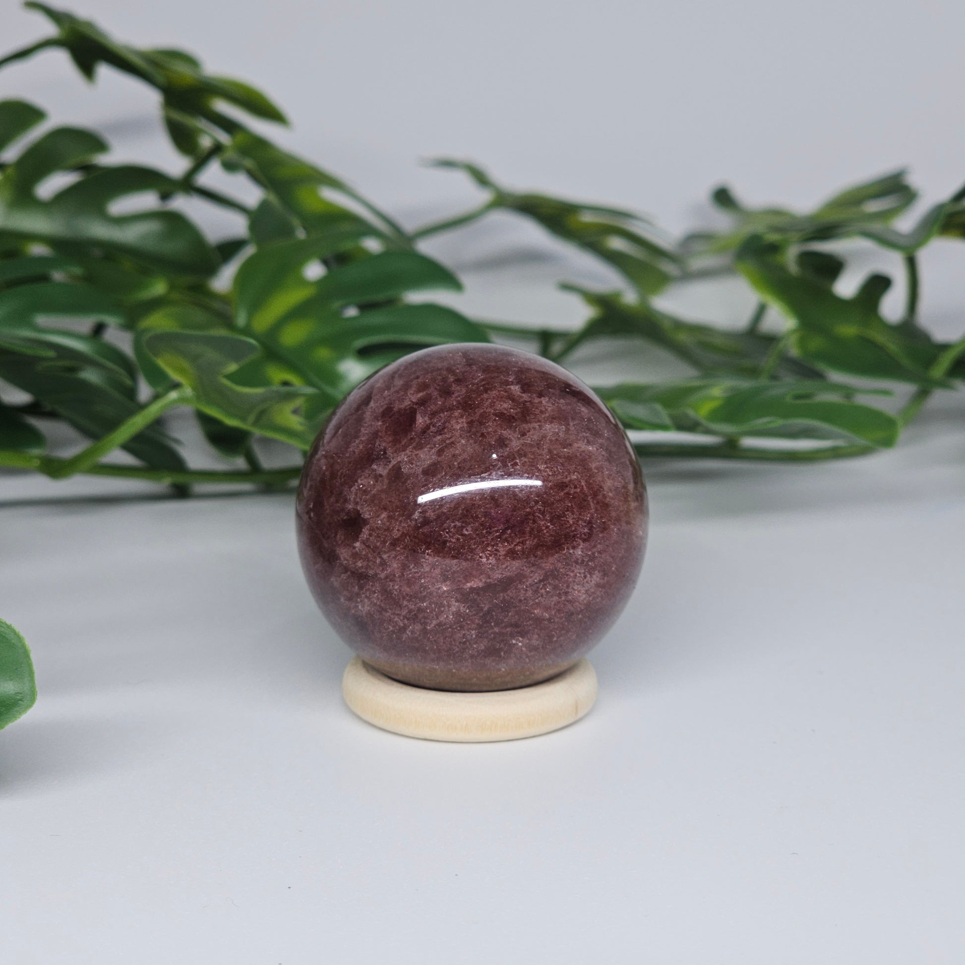 Red Aventurine crystal sphere showing rich red tones and smooth polished finish from side angle