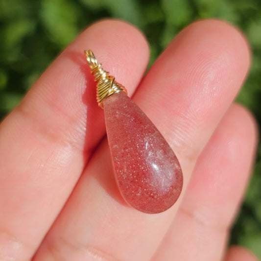 Wire wrapped Red Aventurine in sunlight