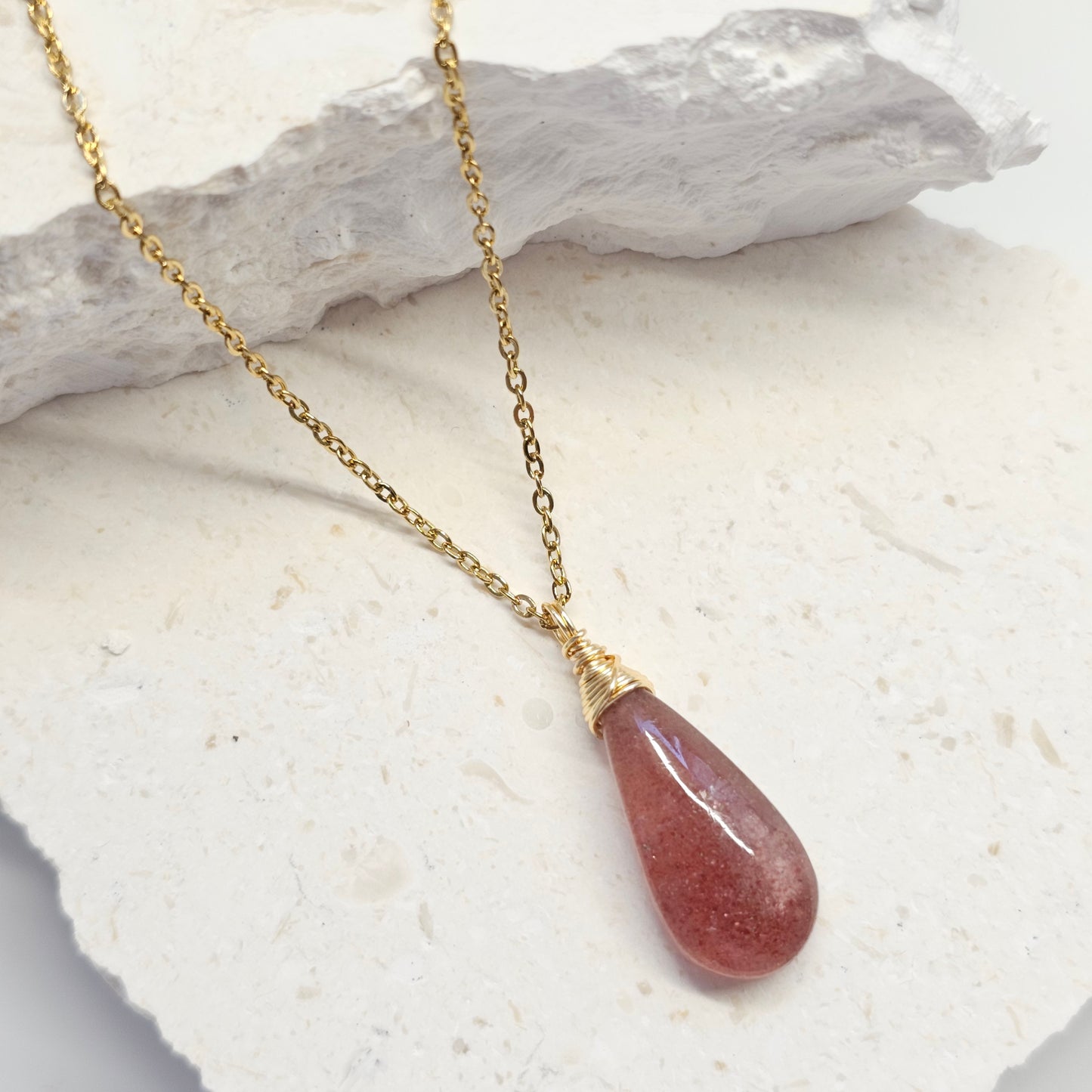 Handmade Red Aventurine necklace laying on neutral background