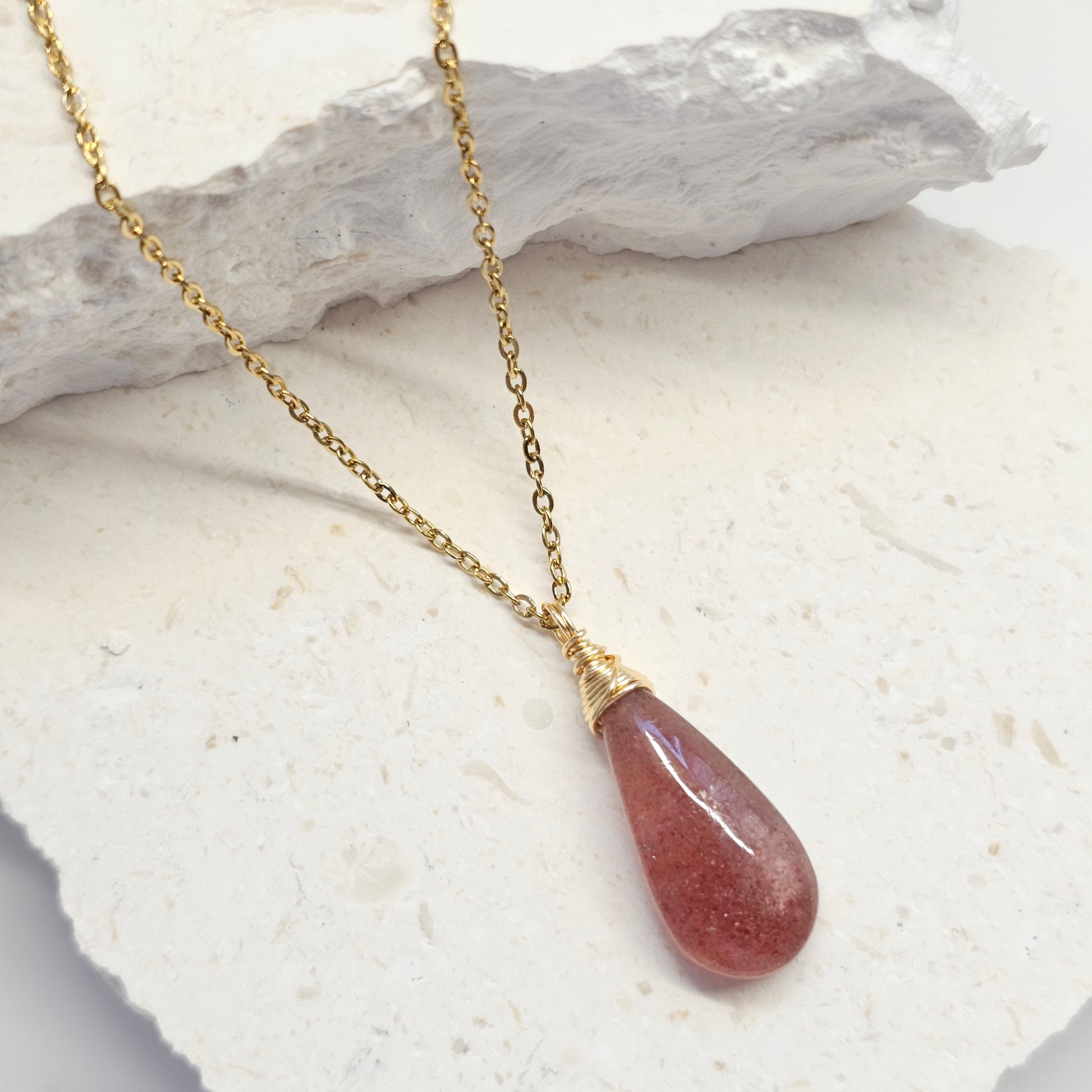 Handmade Red Aventurine necklace laying on neutral background