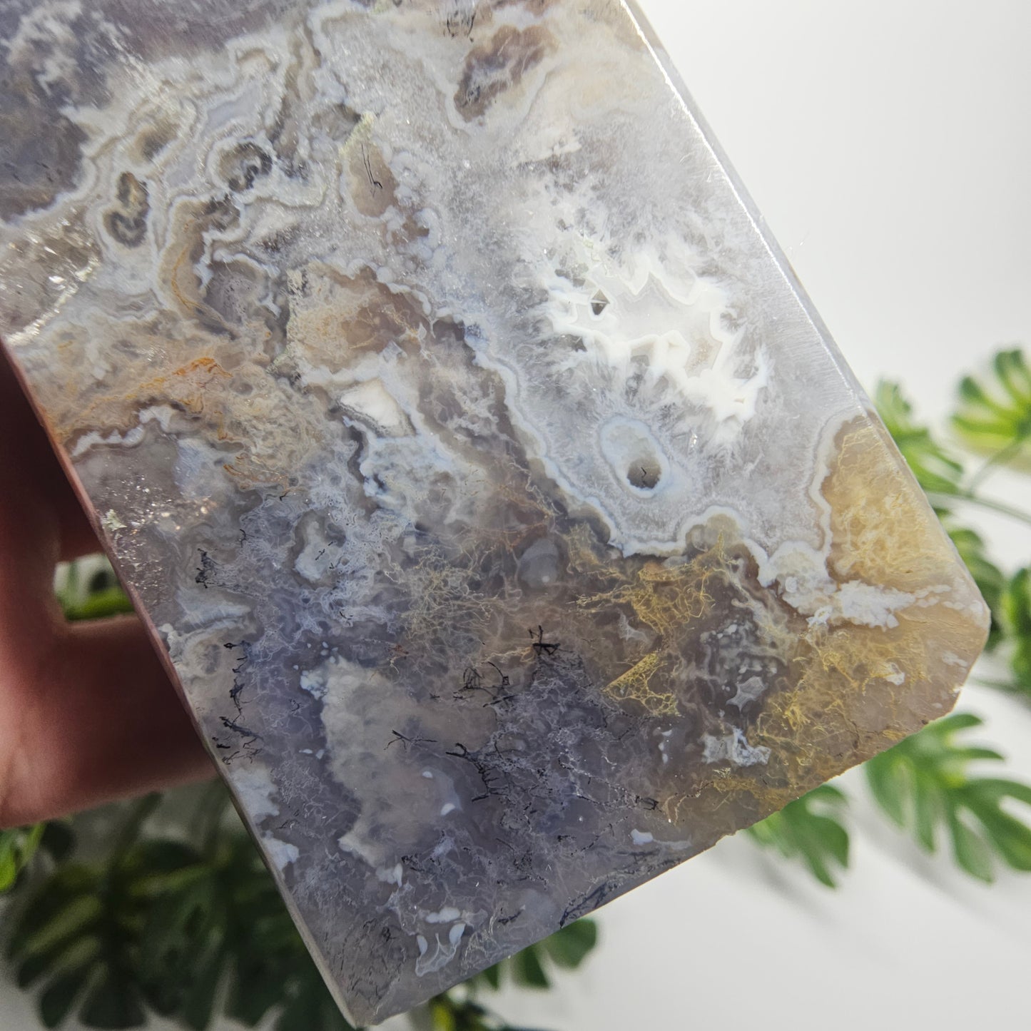 Yellow and lack inclusions with blue chalcedony and agate banding