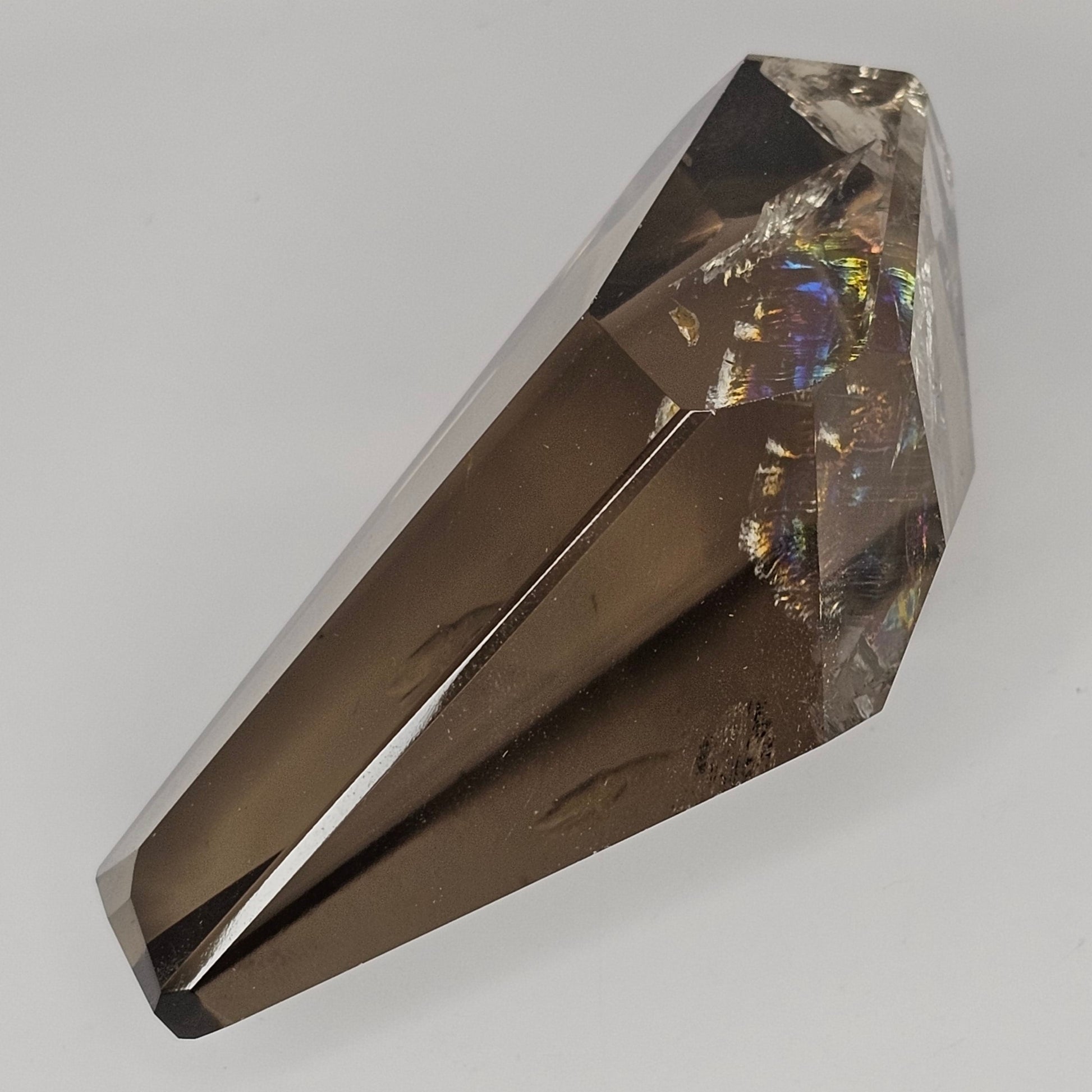 Angle of the Smoky Citrine freeform in natural light revealing vivid internal rainbow inclusions within its highly transparent crystal structure.