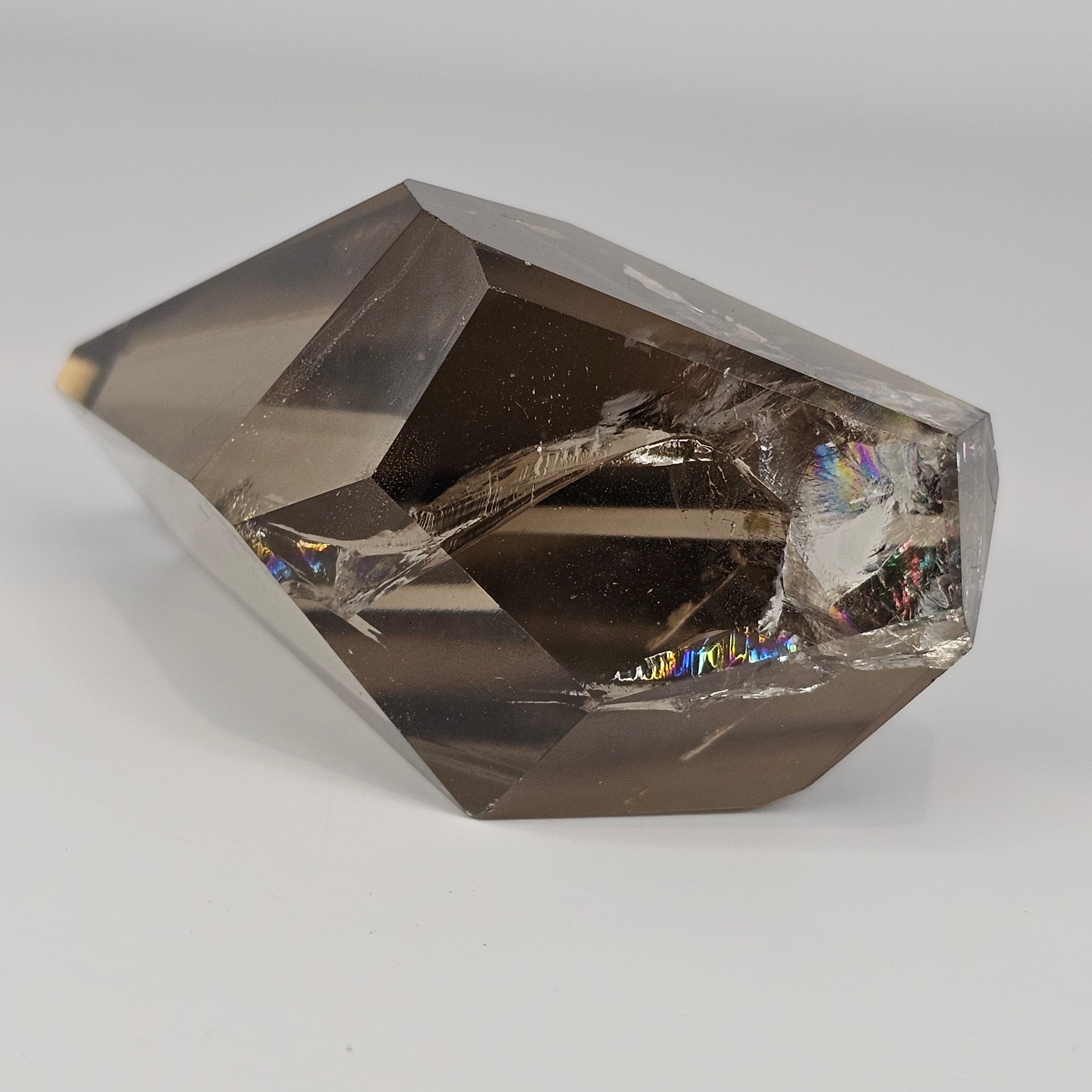 Rotated angle of the freeform showing shifting rainbow reflections inside the Smoky Citrine.