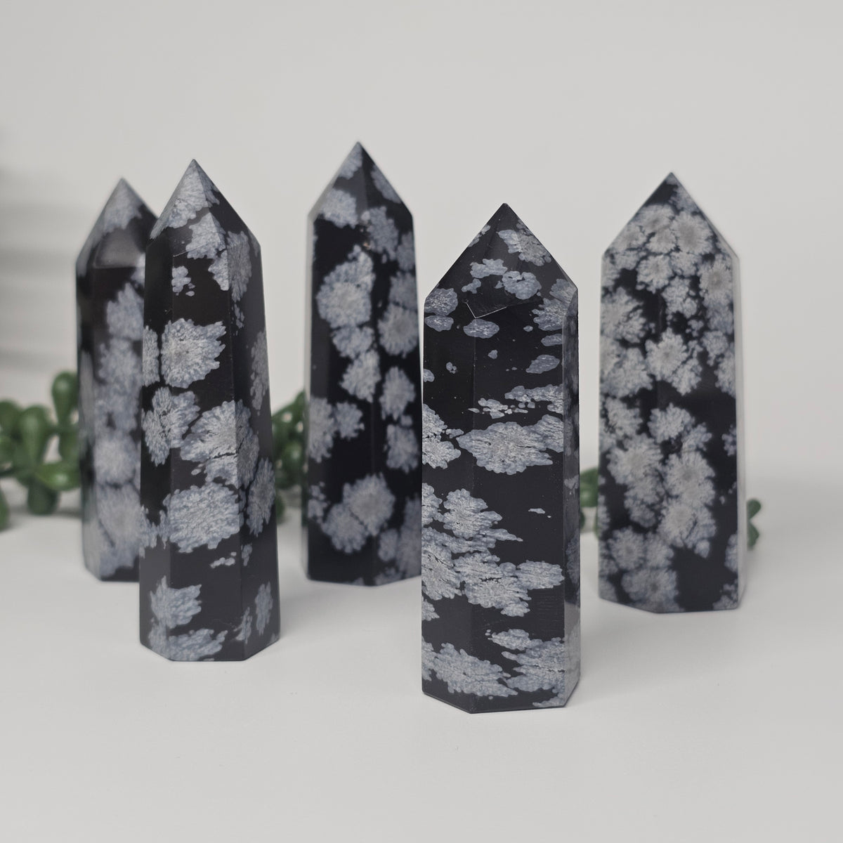 Snowflake Obsidian towers displayed in an upright position