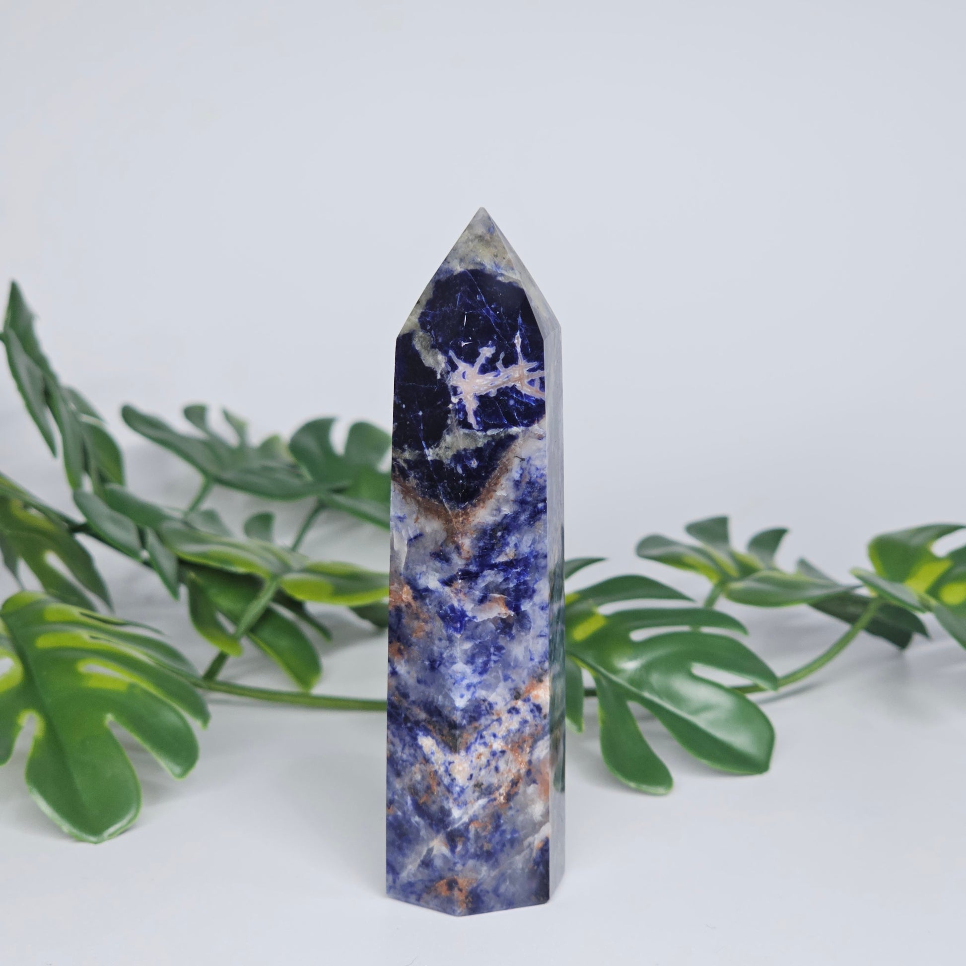 Sodalite tower showing deep blue colour with natural white veining.