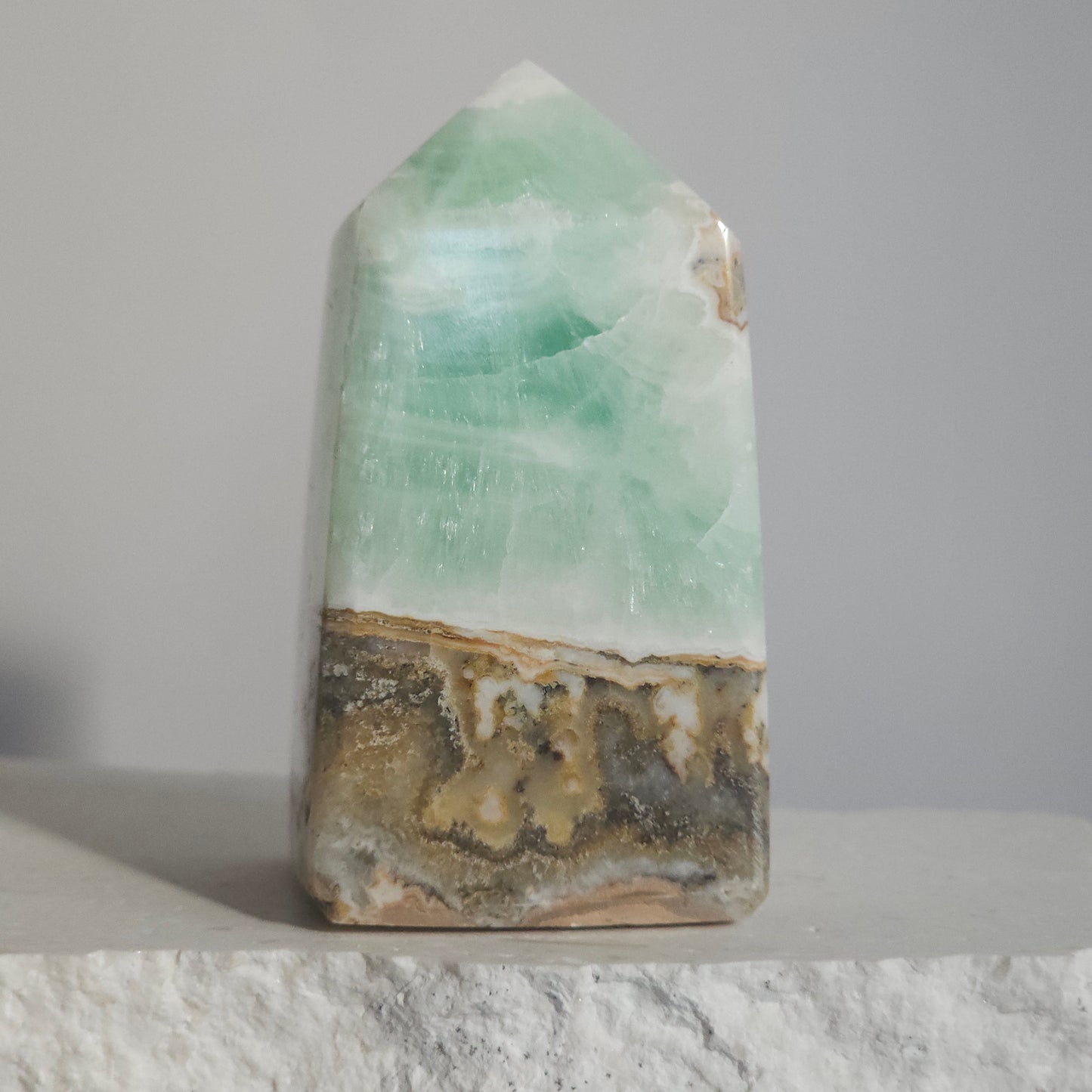 Caribbean Calcite Tower Natural Ocean Beauty with Soft Green Coastal Patterns