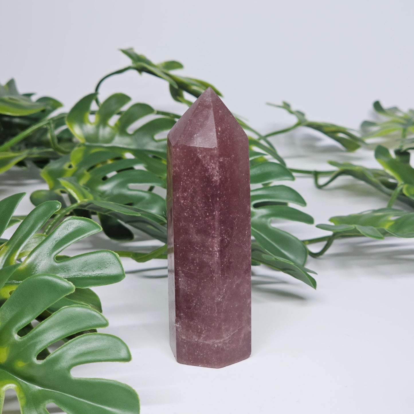 Strawberry quartz crystal tower for love and positivity displayed as home decor