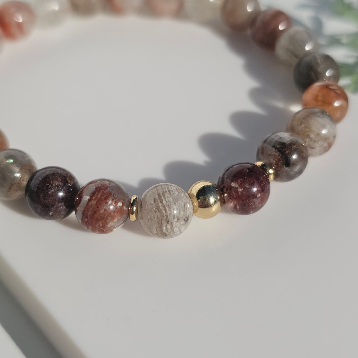 Close up of the 8mm Thousand Layer bead bracelet with gold stainless steel accents