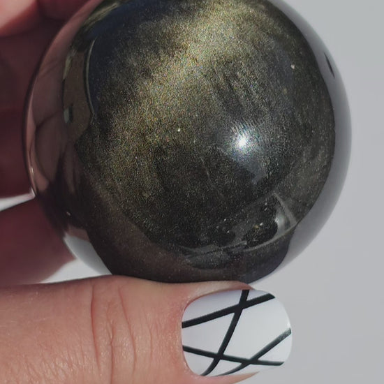 Black Obsidian sphere with an alluring sheen of Gold.