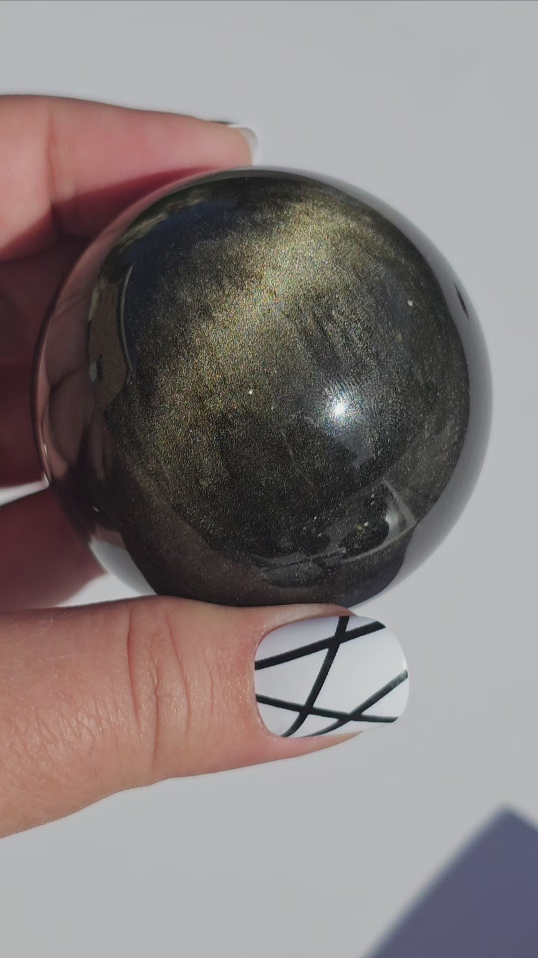 Black Obsidian sphere with an alluring sheen of Gold.