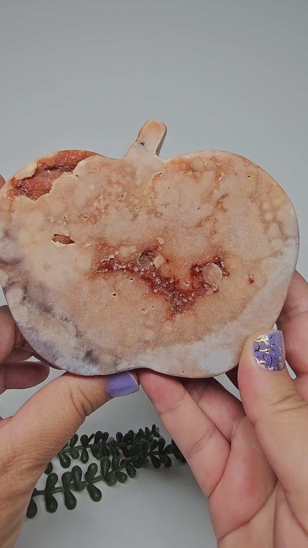 A video walkthrough rotating the Pink Amethyst apple to display all polished sides and sparkling druzy.