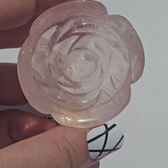 A lovely rose carving from a gemmy Rose Quartz