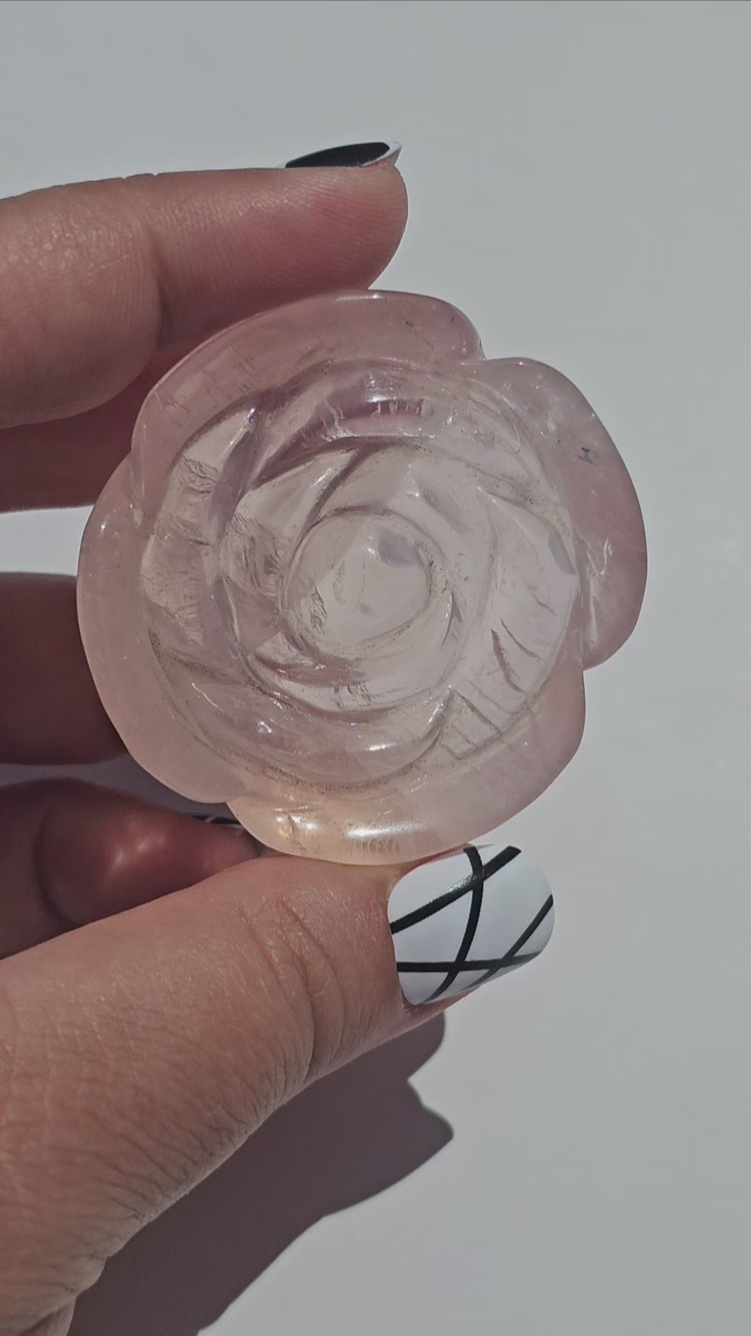 A lovely rose carving from a gemmy Rose Quartz