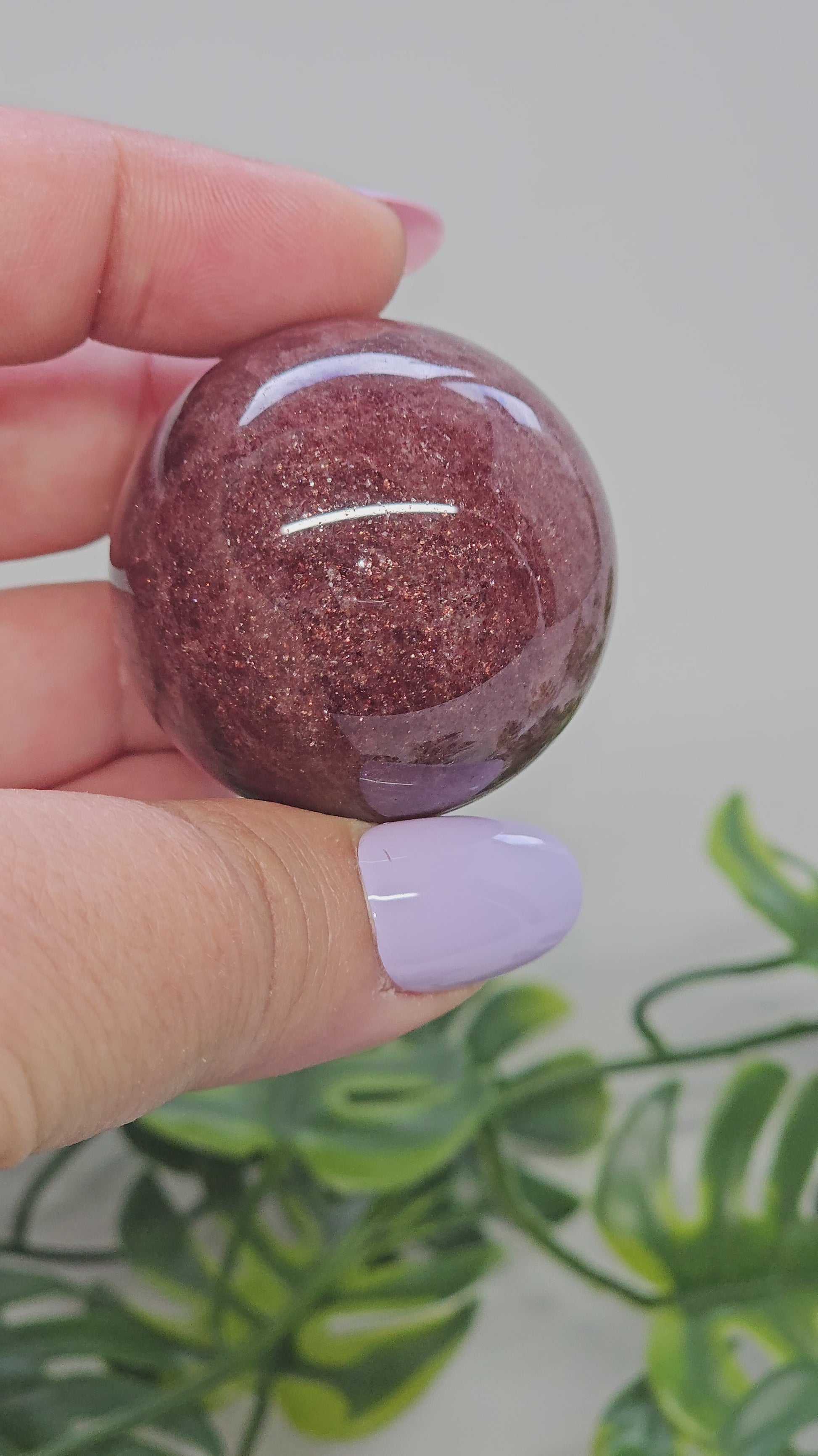 Strawberry Quartz sphere video showing full 360 degree rotation highlighting shimmer, deep colour and polished finish