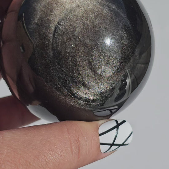 Black Obsidian sphere with an alluring sheen of Silver.