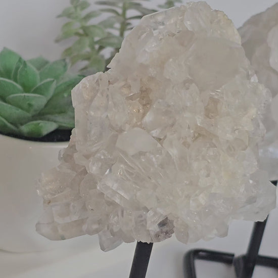 Clear Quartz clusters on black metal stands