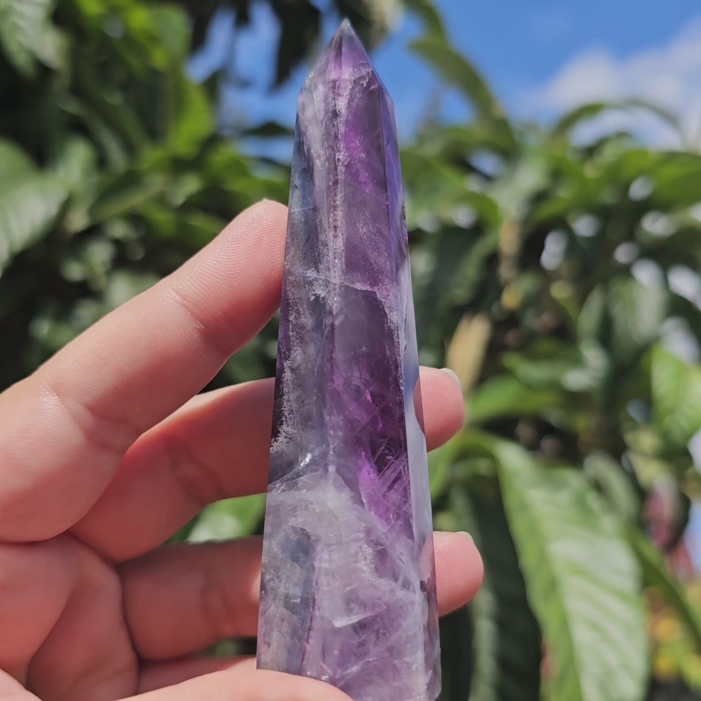 Gorgeous rainbow Fluorite tower with deep purple, blue and green banding. Also has stunning rainbows throughout.