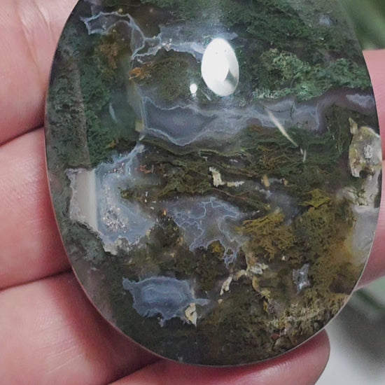 Beautiful forest green and earthy golden brown Moss Agate palm stone from Indonesia