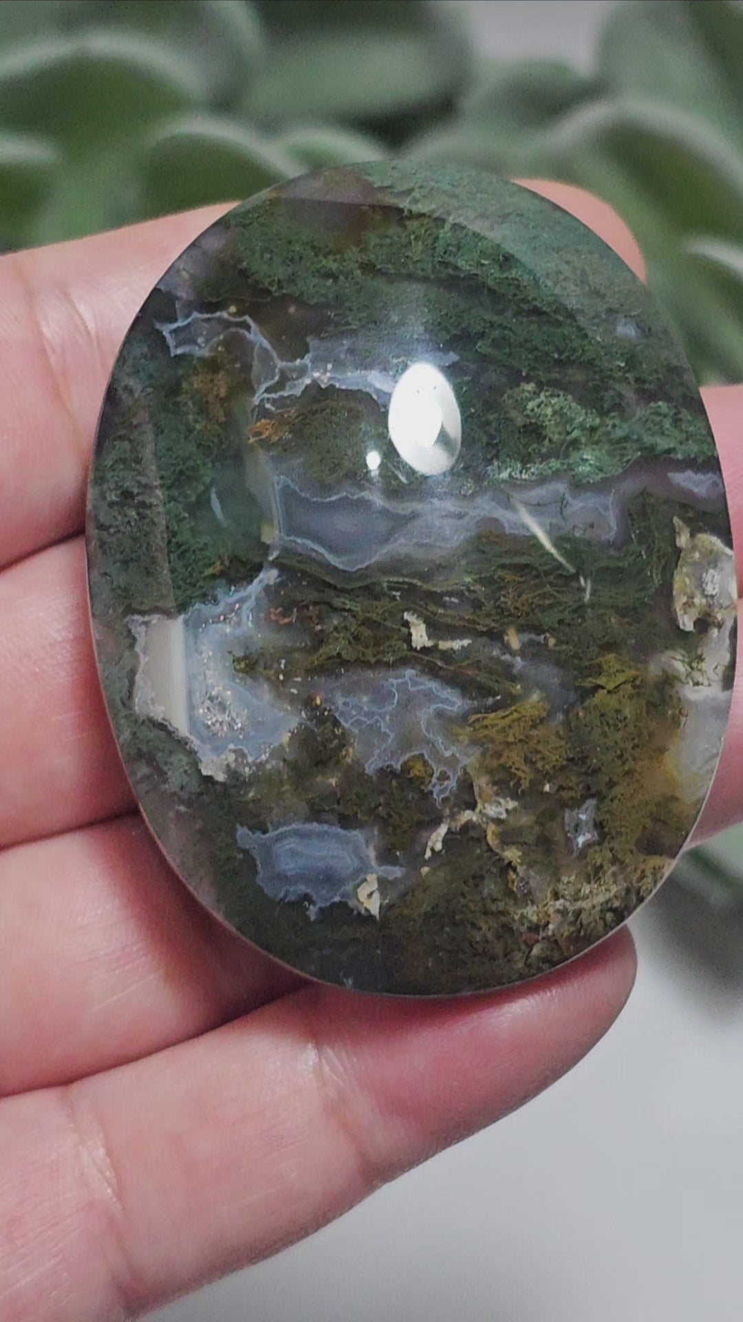 Beautiful forest green and earthy golden brown Moss Agate palm stone from Indonesia