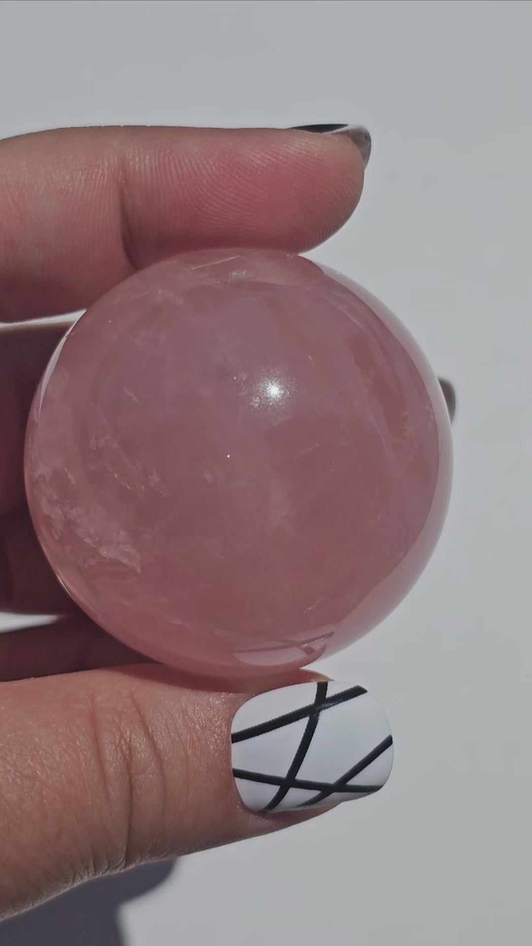 A beautiful Rose Quartz sphere with asterism and gorgeous rainbows