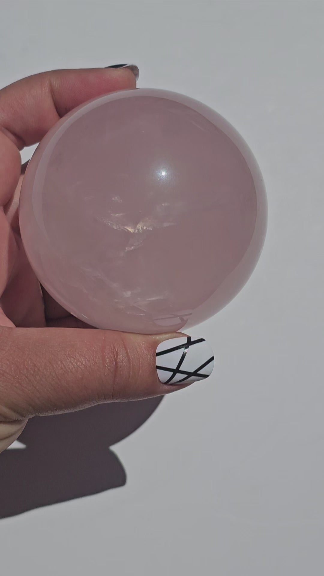 A beautiful Rose Quartz sphere with flash and gorgeous rainbows