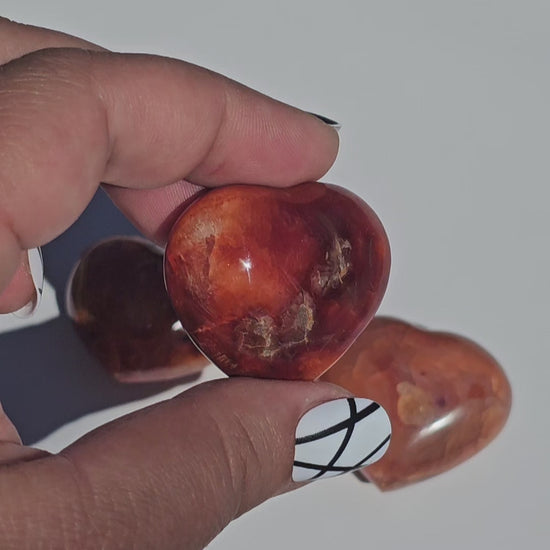 Small beautifully carved puffy Carnelian hearts.