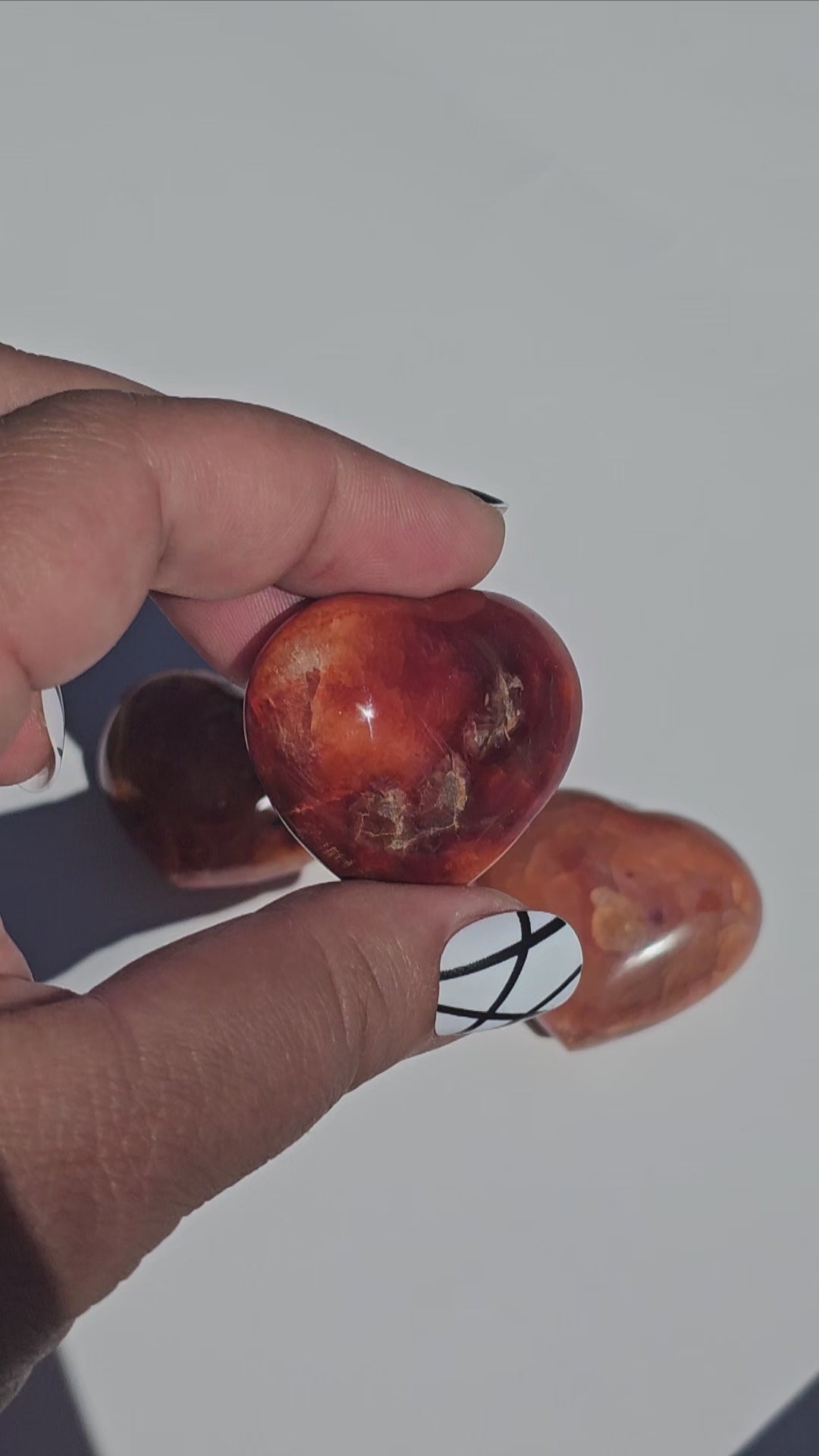 Small beautifully carved puffy Carnelian hearts.