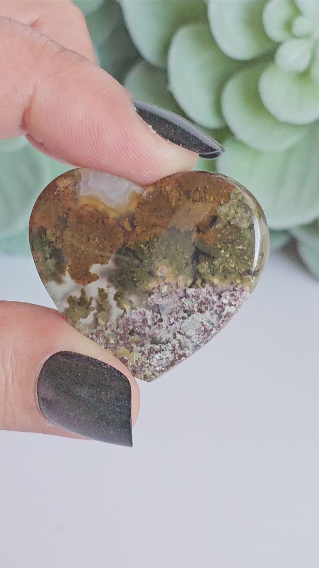 An exquisite heart carving, showcasing the alluring uniqueness of the Scenic Moss Agate which resembles nature's beautiful landscapes.