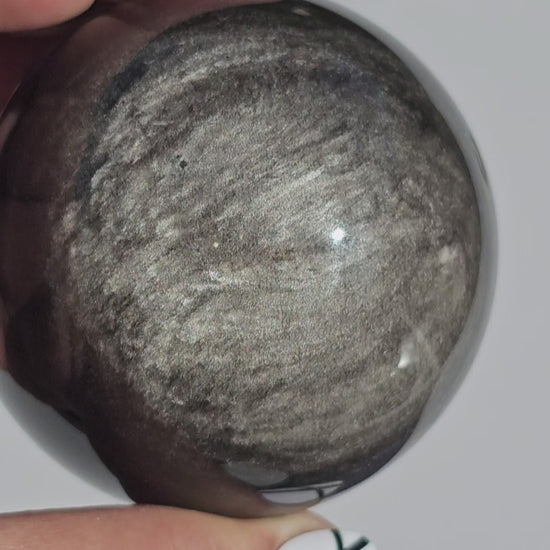 Black Obsidian sphere with an alluring sheen of Silver.