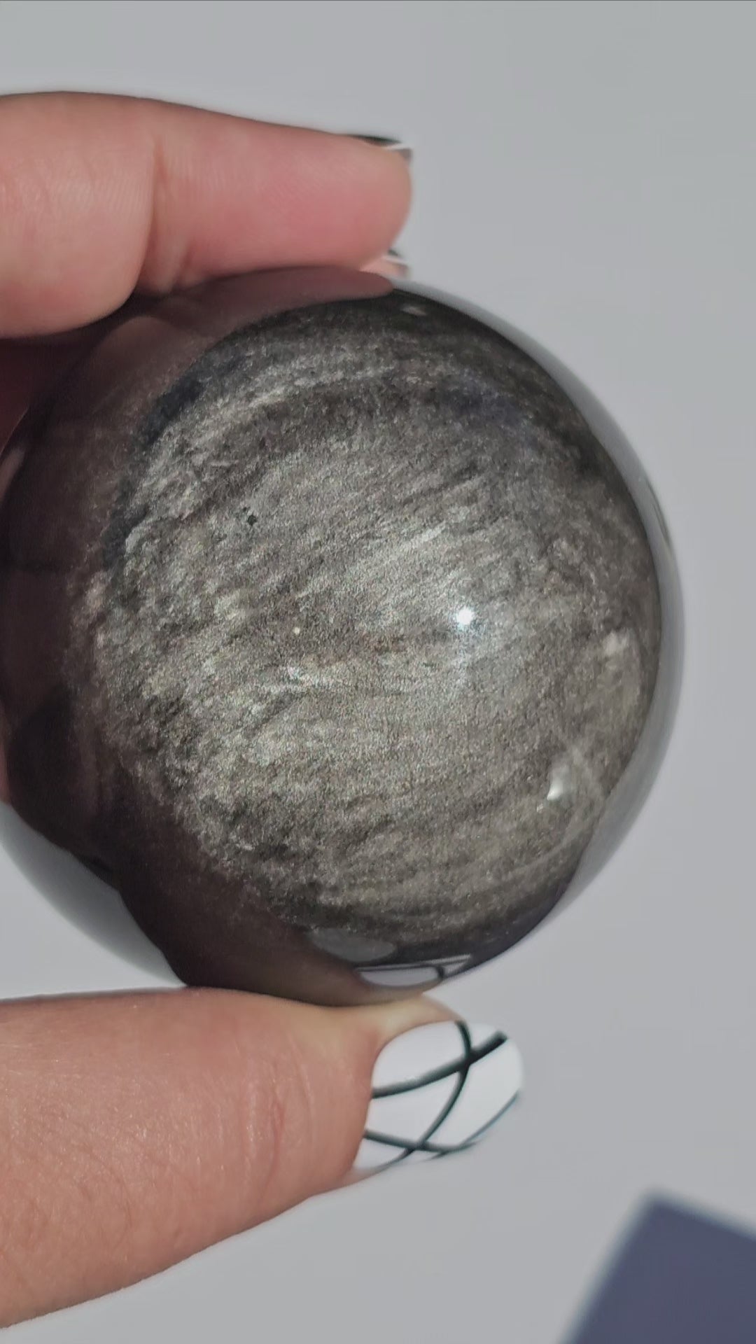 Black Obsidian sphere with an alluring sheen of Silver.