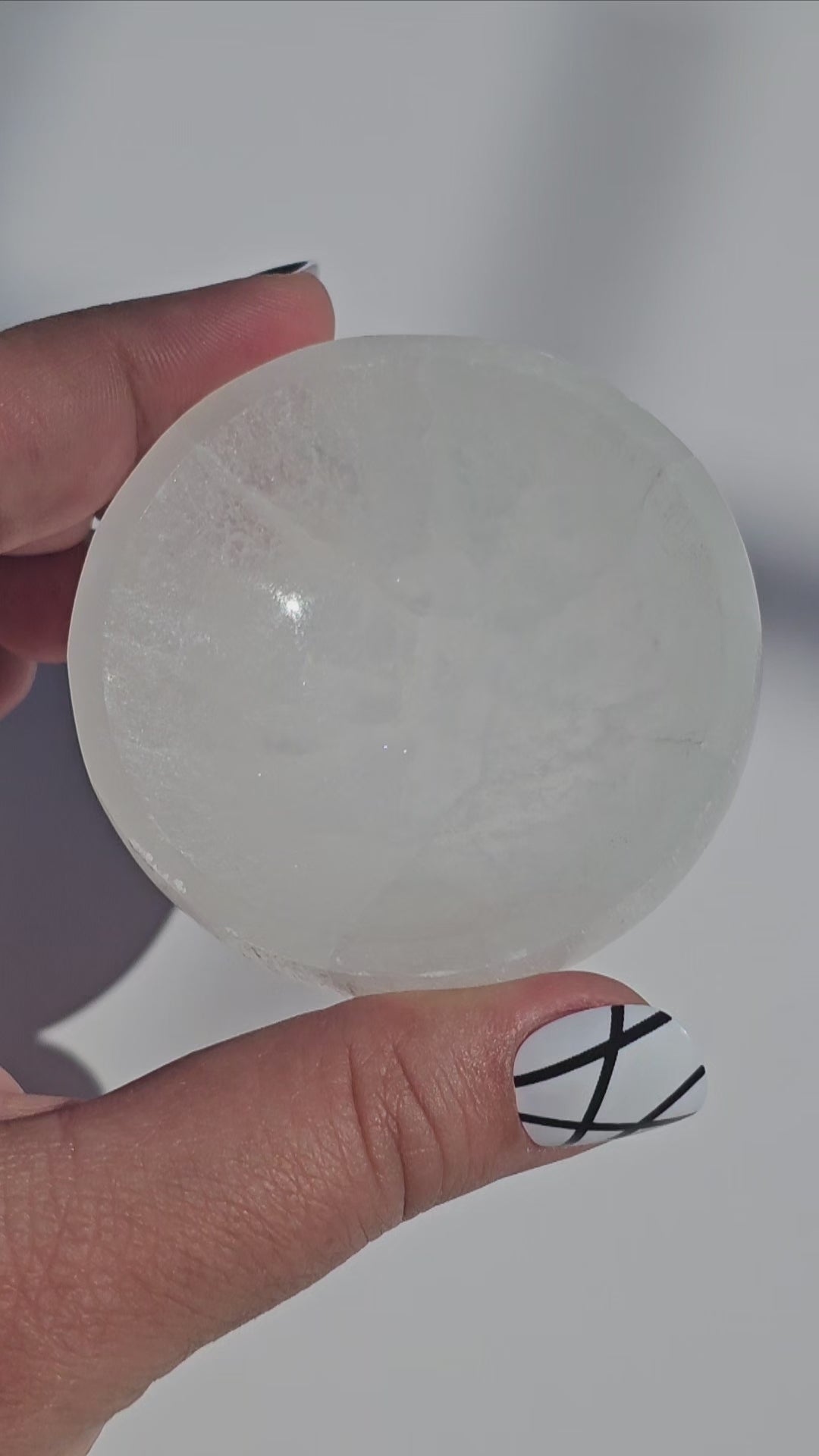 A small Selenite round dish perfect for cleansing your mini crystals.