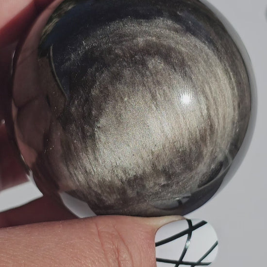 Black Obsidian sphere with an alluring sheen of Silver.