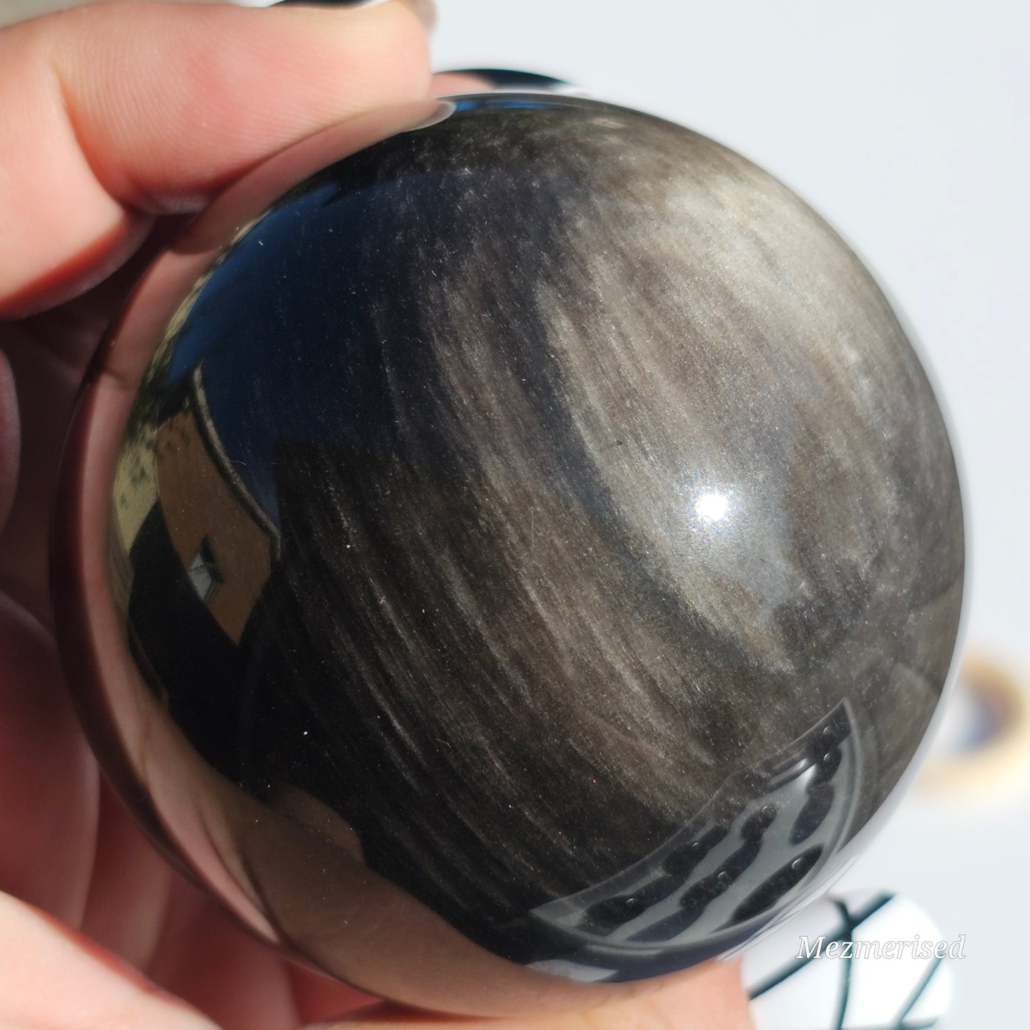 Black Obsidian sphere with an alluring sheen of Silver.