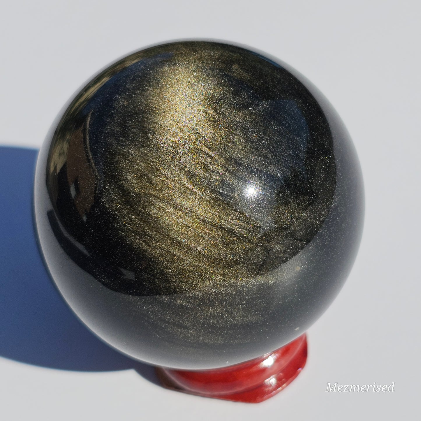 Black Obsidian sphere with an alluring sheen of Gold.