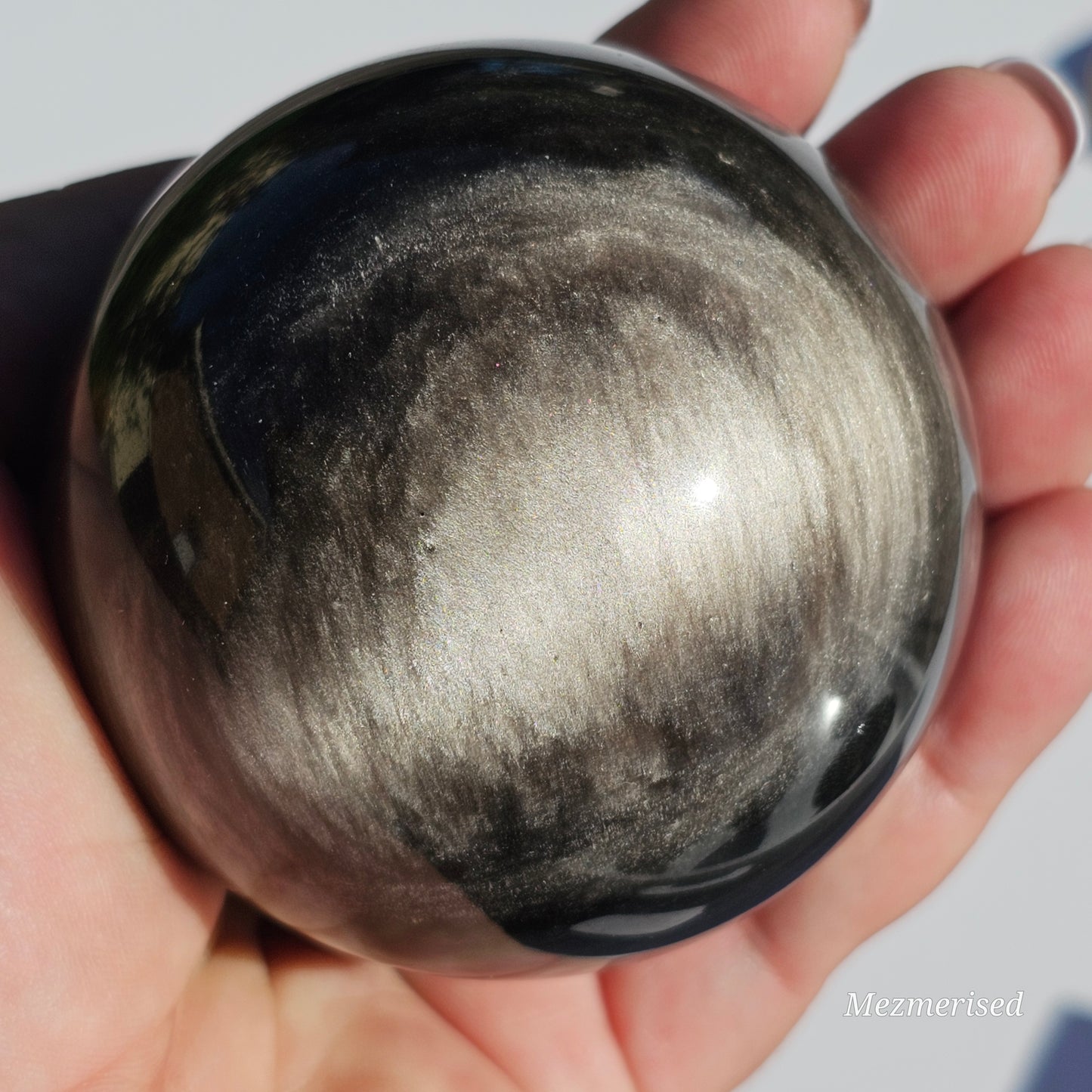 Black Obsidian sphere with an alluring sheen of Silver.