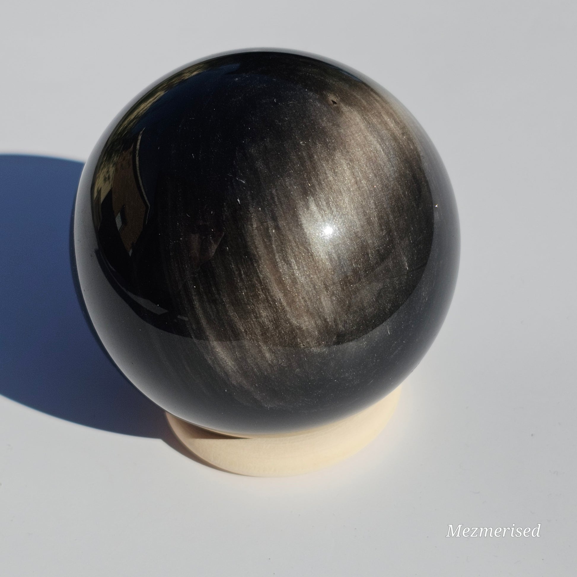 Black Obsidian sphere with an alluring sheen of Silver.