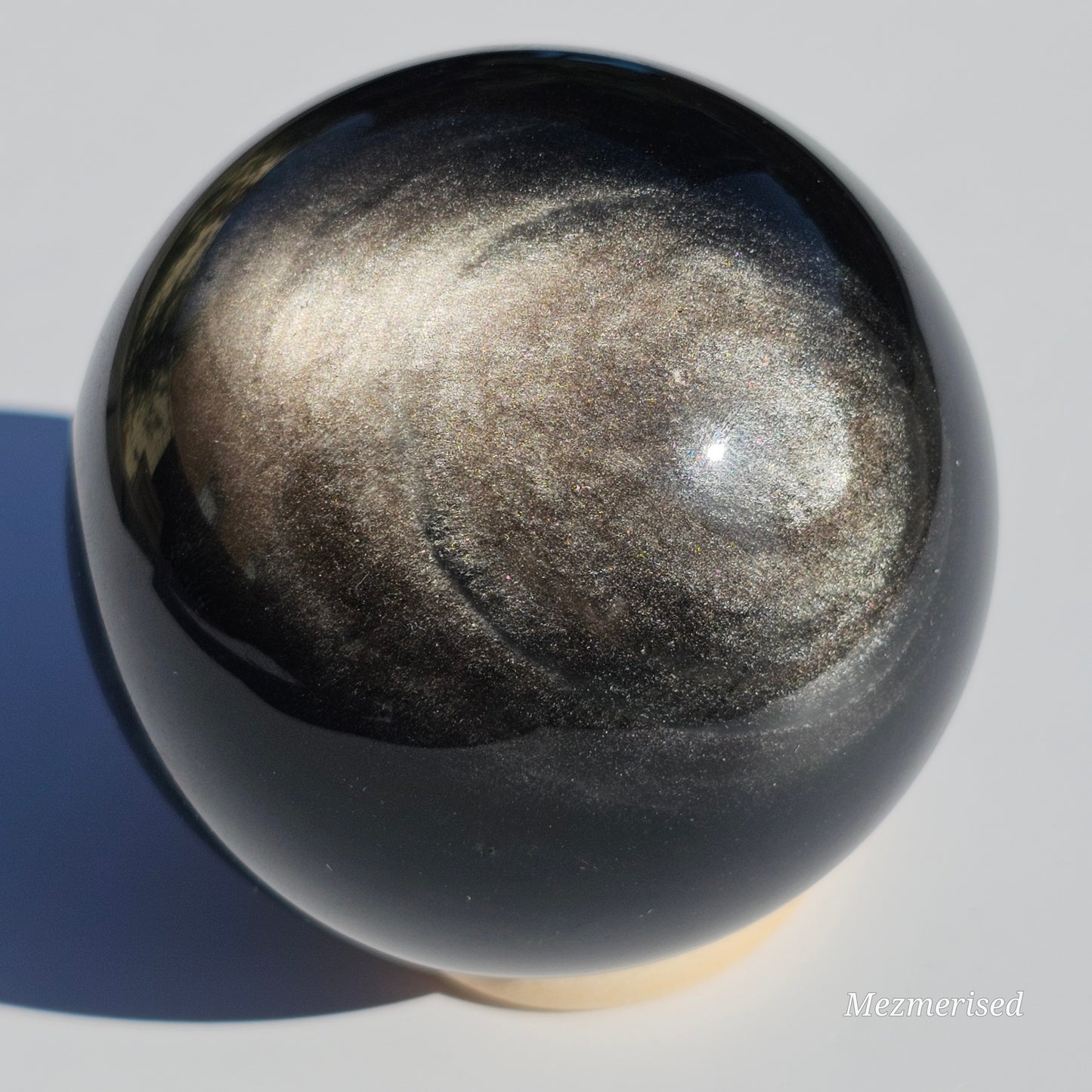 Black Obsidian sphere with an alluring sheen of Silver.