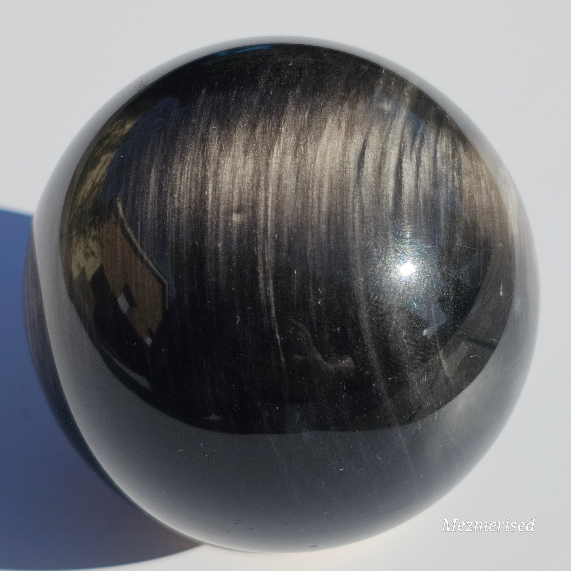 Black Obsidian sphere with an alluring sheen of Silver.