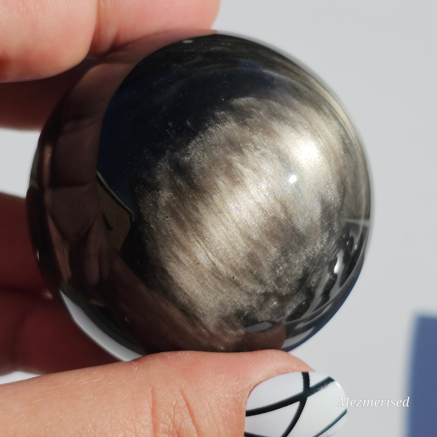 Black Obsidian sphere with an alluring sheen of Silver.