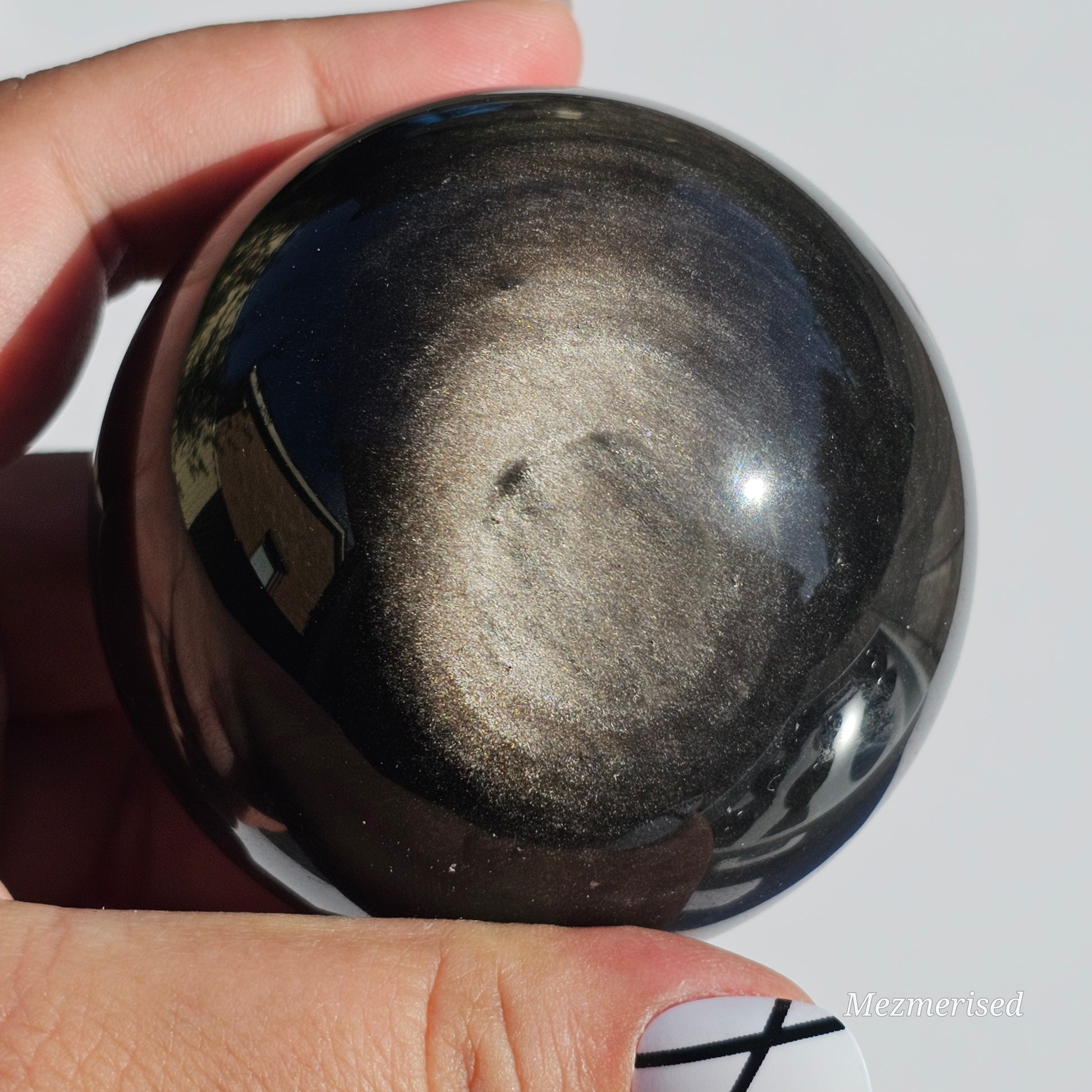 Black Obsidian sphere with an alluring sheen of Silver.