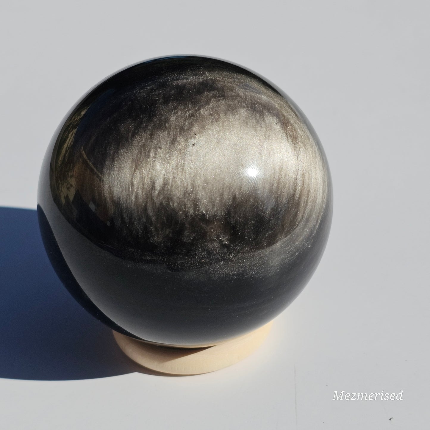 Black Obsidian sphere with an alluring sheen of Silver.