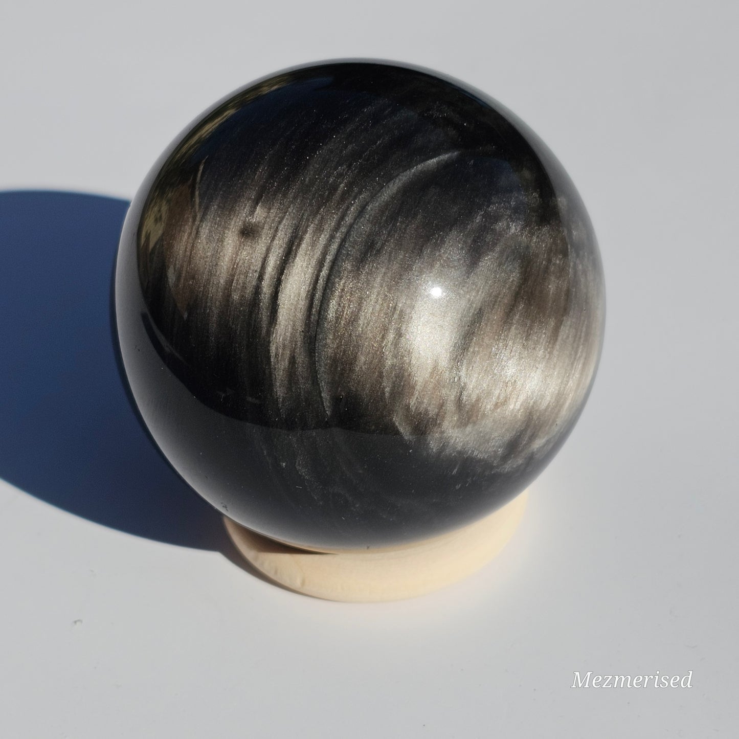 Black Obsidian sphere with an alluring sheen of Silver.