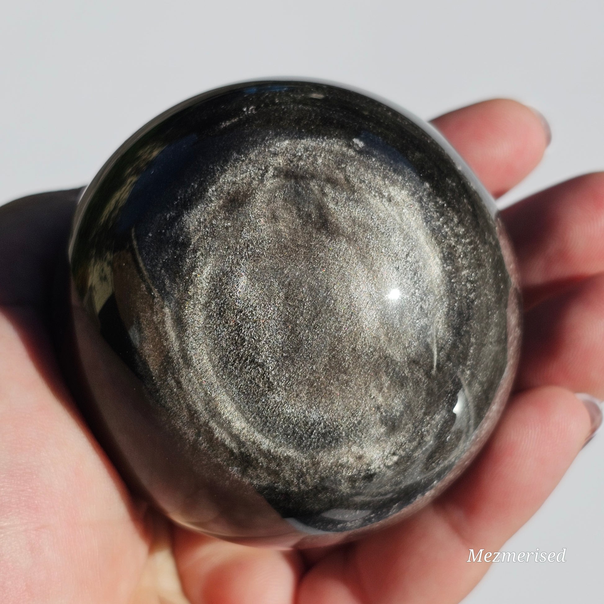 Black Obsidian sphere with an alluring sheen of Silver.