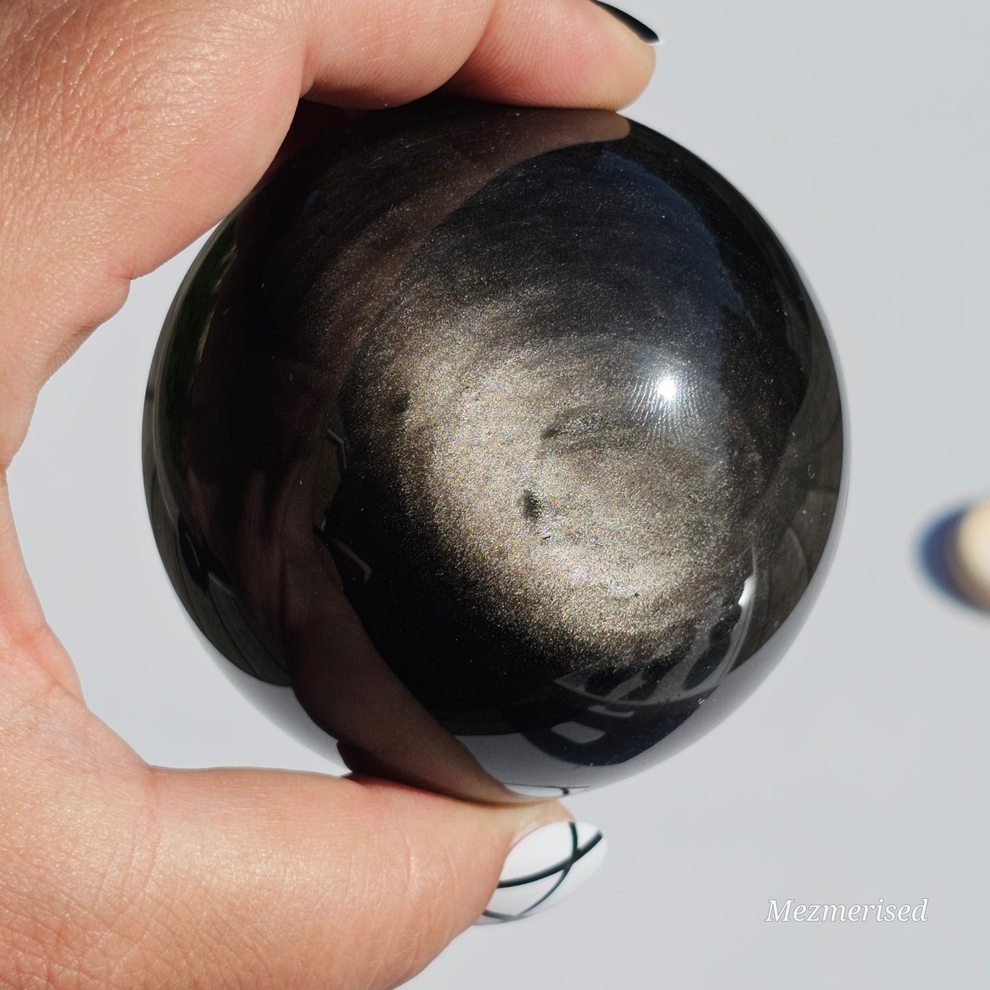 Black Obsidian sphere with an alluring sheen of Silver.